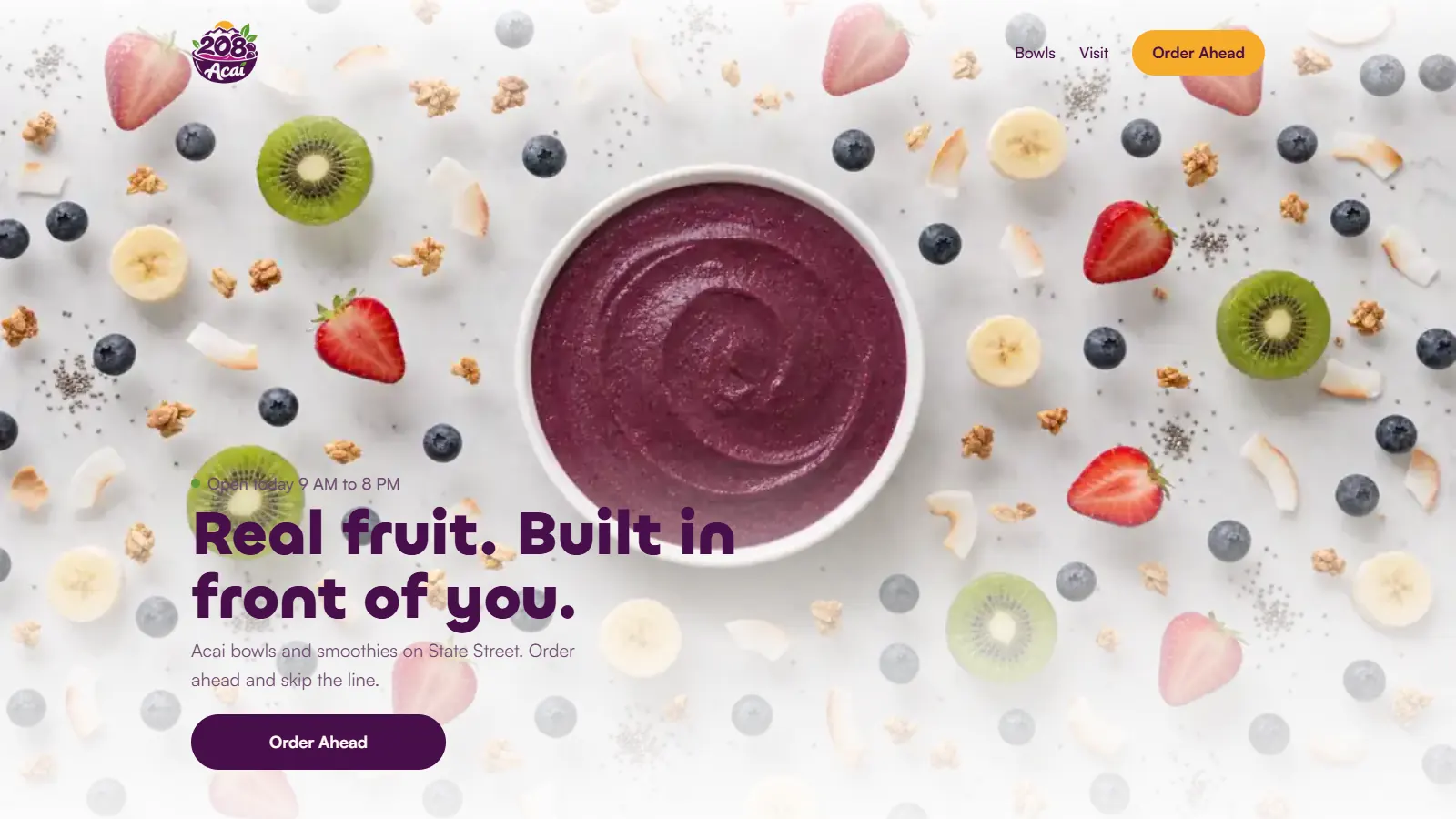 The 208 Acai home page on a laptop: an acai bowl among fresh fruit under the headline Real fruit. Built in front of you.