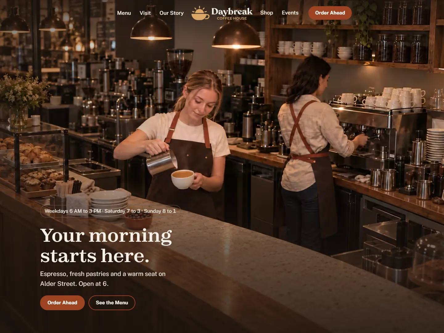 The Daybreak Coffee House home page in a browser: a barista pouring a latte under the headline Your morning starts here.
